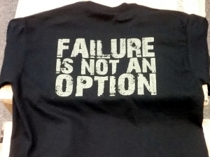 An image of a black t-shirt with the slogan 'Failure is not an option'