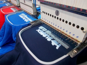 An image of a logo embroidery machine at work