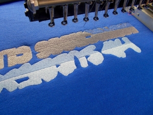An image of a logo embroidery machine at work