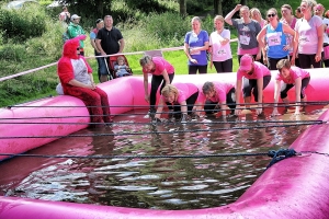 An image of the 'Mad Mud Spinners' doing the Race For Life