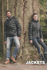 An image of a man and woman wearing black puffer jackets