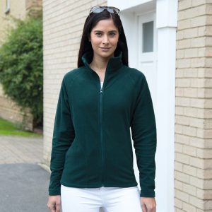 An image of a woman wearing a green fleece jacket