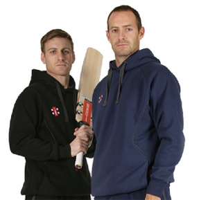 An image of two cricketers wearing hoodies
